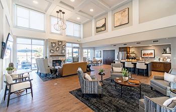 Resident lounge with kitchen, dining space and fireplace